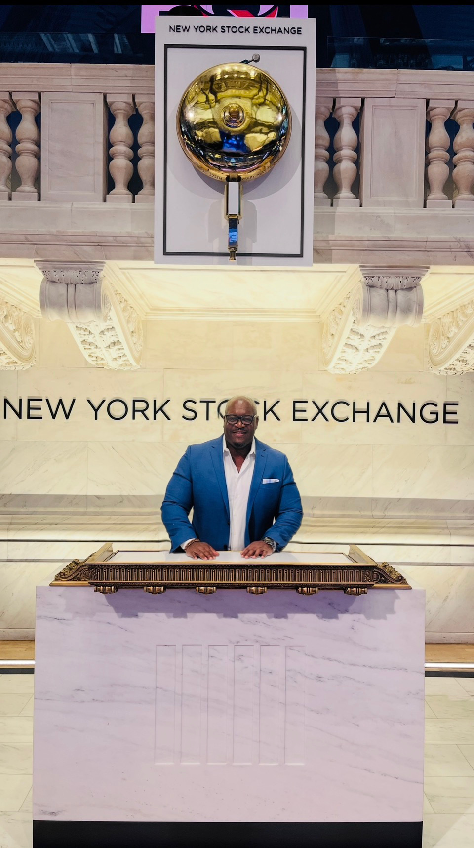 Dante Simpson at the New York Stock Exchange bell podium
