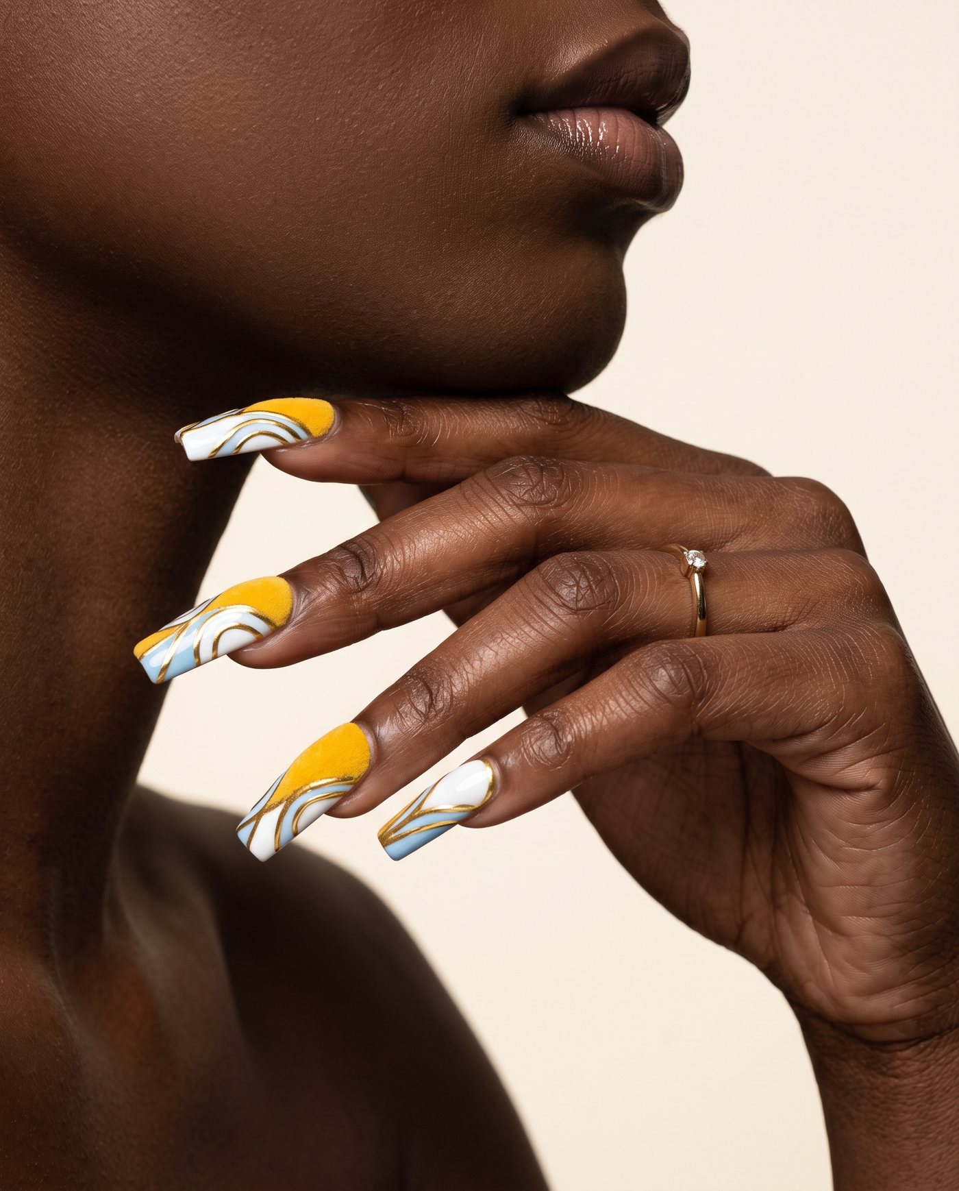 Long coffin nails with gold linework, blue and white swirls and yellow velvet panels